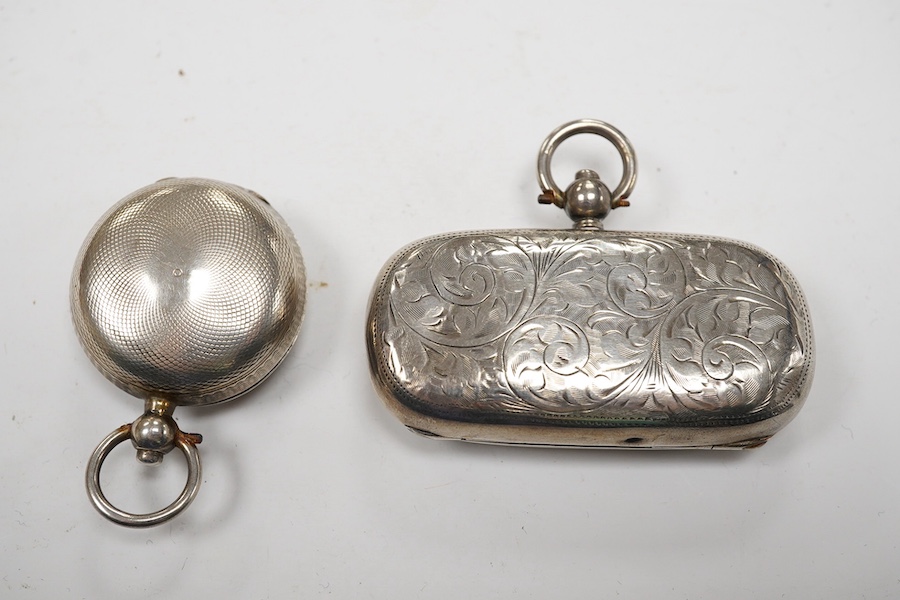 An Edwardian silver combination stamp/sovereign case, marks rubbed, Chester, 1909, 57mm and a similar sovereign case, marks rubbed, Chester, 1901. Condition - poor